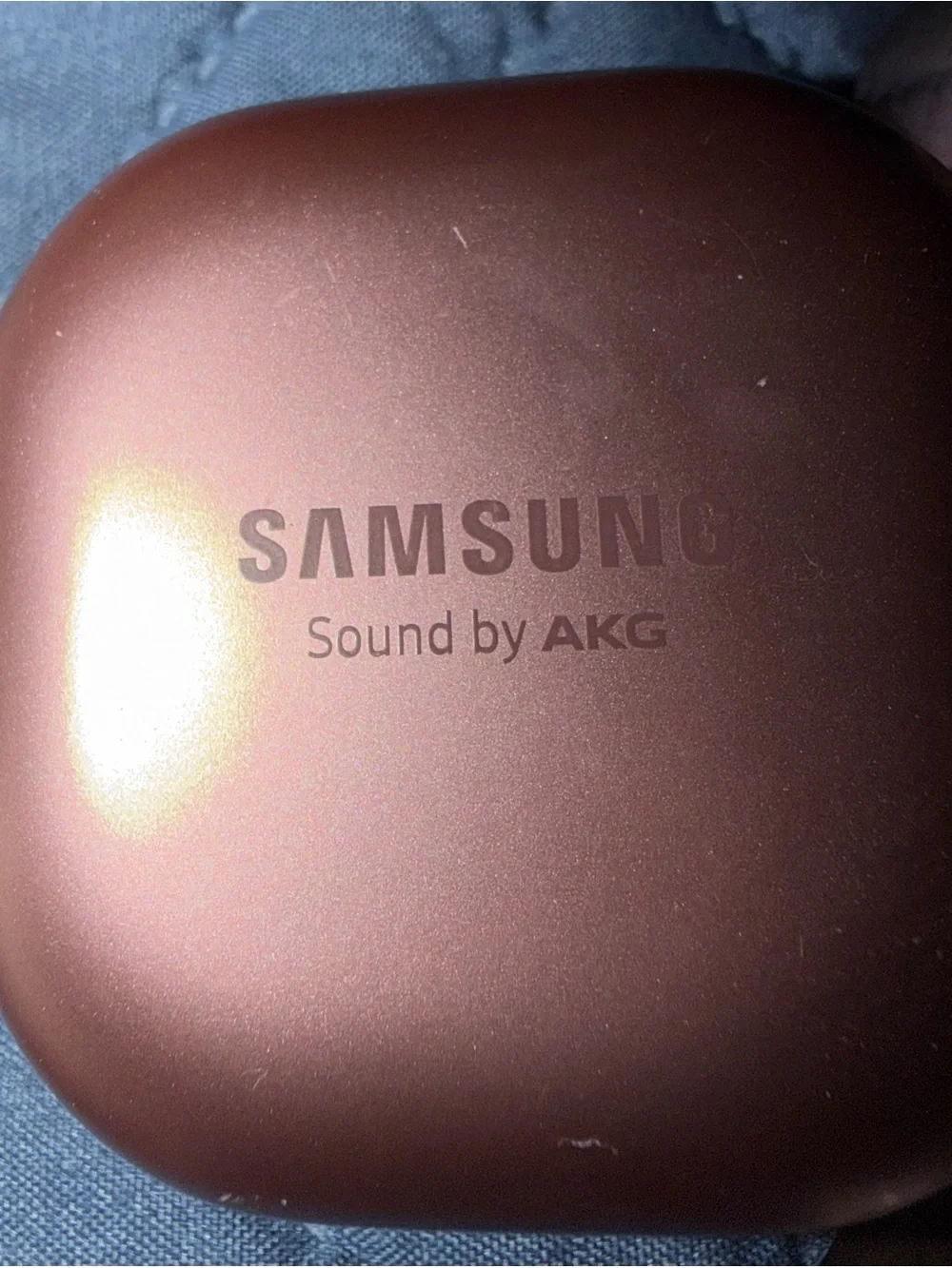 Samsung Earbuds with Charging Case in Rose Copper and Carrying case included.
